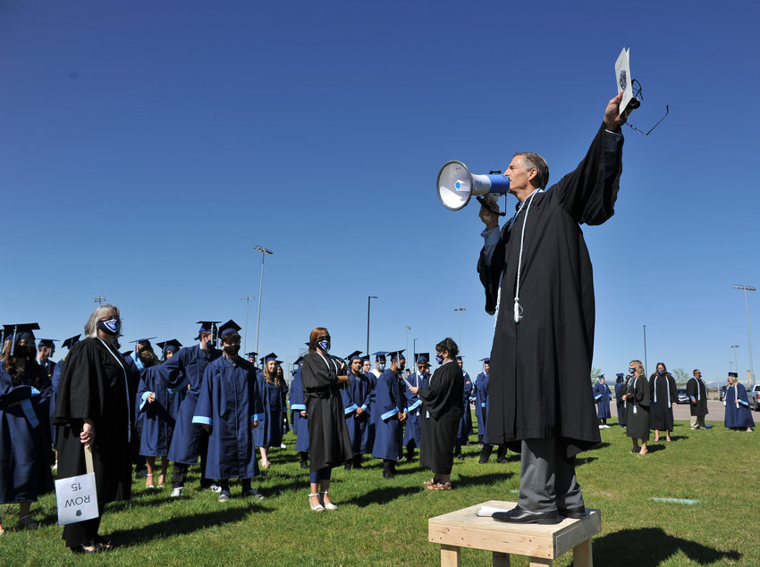 Riverdale Ridge Principal Terry Elliott gives last-minute instructions to 2021 graduates ahead of the first-ever graduation at the new 27J high school in Thornton May 24.